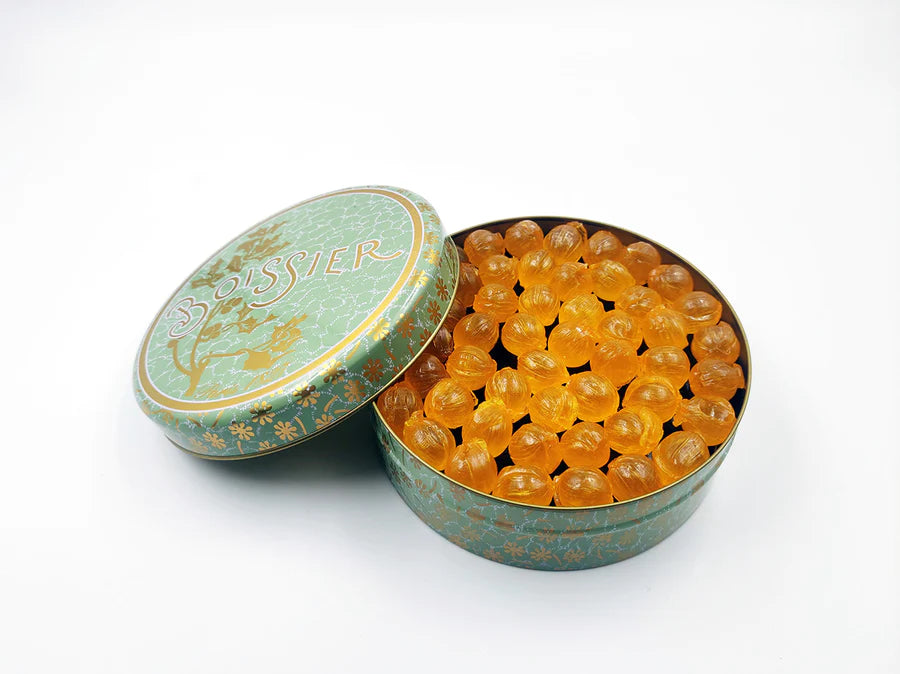 Indulge in the rich heritage of French confectionery with Maison Boissier's legendary "Boule" Pineapple Hard Candy, presented in a collector's 275-gram tin. These exquisite candies, envisioned by Bélisaire Boissier nearly two centuries ago, encapsulate the essence of luxury and refinement. 